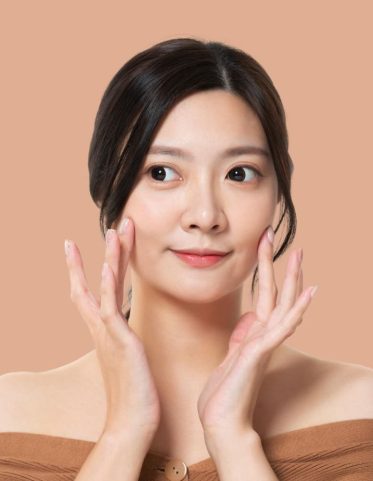 Beautiful Model Girl With Perfect Fresh Clean Skin Youth Skin Care Concept Isolated Pastel Brown Background